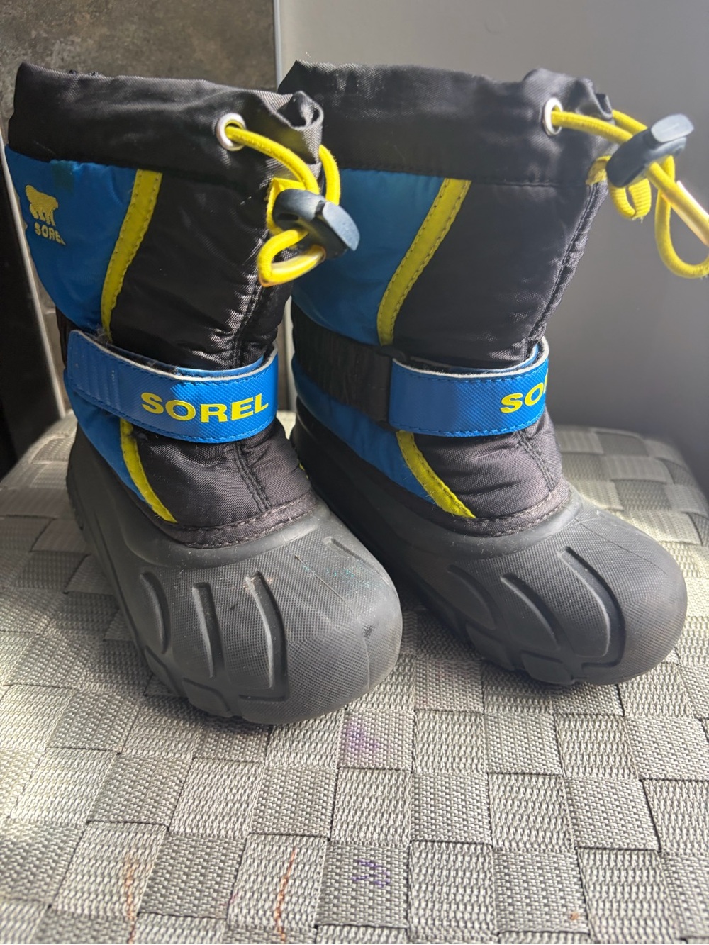 Sorel Kids Black and Blue Snow Boots with Yellow Accents